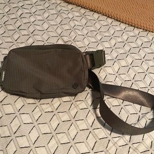 like new Lululemon belt bag. Grid pattern with gunmetal hardware